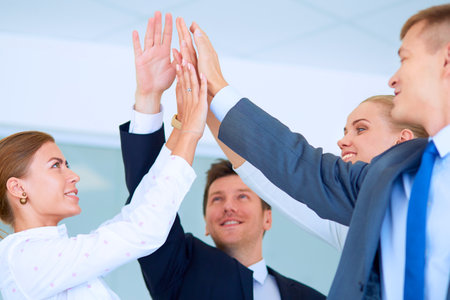 Business people with their hands together in a circleの写真素材