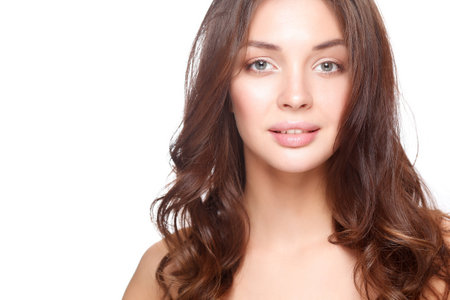 Close up portrait of beautiful young woman face. Isolated on white background.の写真素材