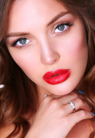 Beautiful woman skin with red lips on white backgroundの写真素材