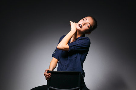 Portrait of beautiful young woman face. Isolated on black backgroundの写真素材