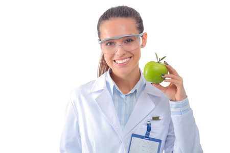 Smiling woman doctor with a green apple. Woman doctorの写真素材