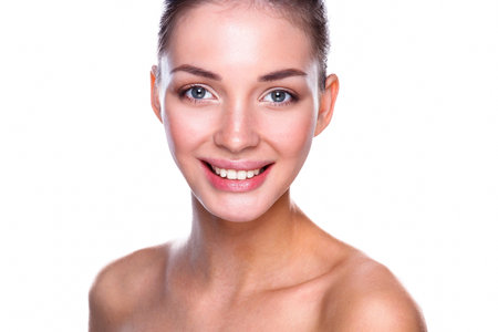 Portrait of beautiful young woman face. Isolated on white backgroundの写真素材