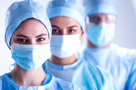 Team surgeon at work in operating roomの写真素材