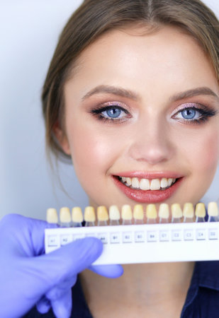 Dentist and patient sitting in dentist officeの写真素材