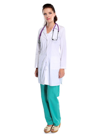Smiling female doctor with a folder in uniform standing at hospital. Smiling female doctorの写真素材