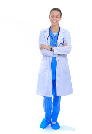 Beautiful young woman in white coat posing with hand in pocket. Woman doctorの写真素材