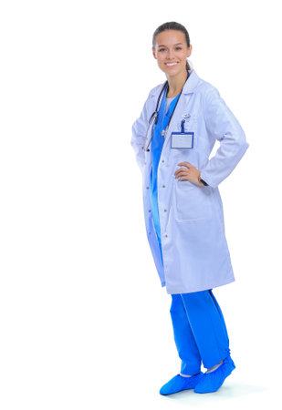 Beautiful young woman in white coat posing with hand in pocket. Woman doctorの写真素材