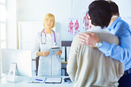 Medical doctor and young couple patients in hospitalの写真素材