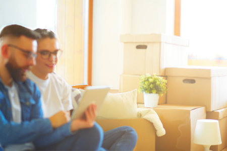 Young couple moving in to new home togetherの写真素材