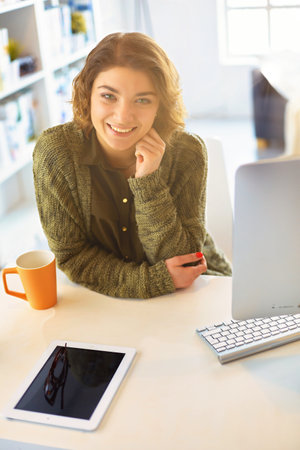 Beautiful smiling female student using online education serviceの写真素材