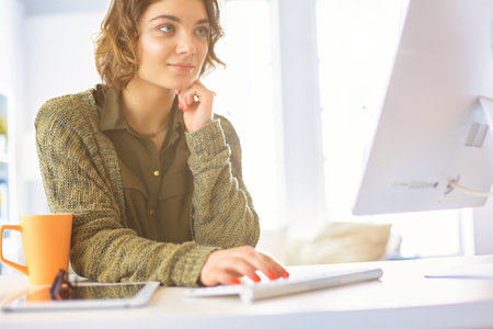 Beautiful smiling female student using online education serviceの写真素材