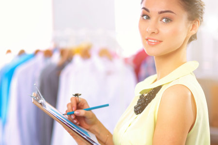 Modern young fashion designer working at studio.の写真素材
