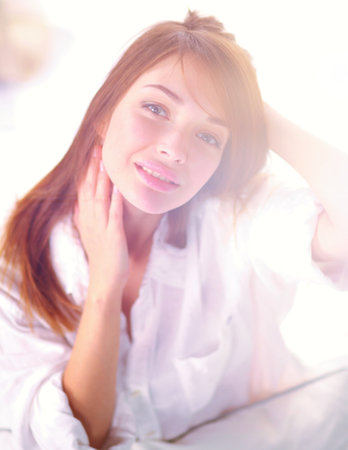 Portrait of beautiful young woman face. Isolated on white background.の写真素材