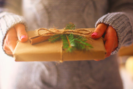 Hands of woman holding christmas gift box. Christmasの写真素材