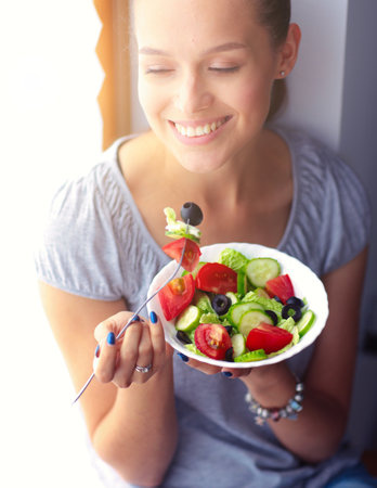 A beautiful girl eating healthy food. Beautiful girlの写真素材