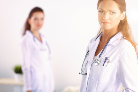 Two young woman doctor , standing in hospitalの写真素材