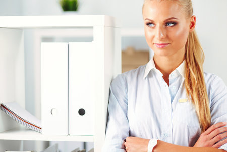 Modern business woman standing in the officeの写真素材