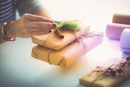 Hands of woman holding christmas gift box.の写真素材