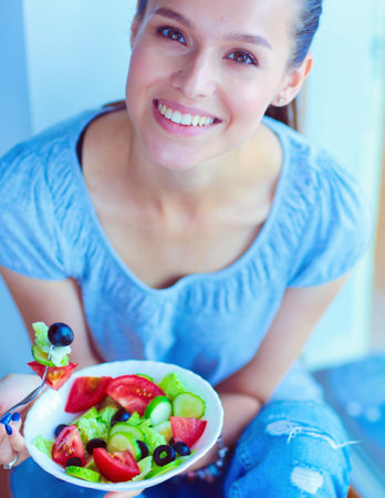A beautiful girl eating healthy food. Beautiful girlの写真素材
