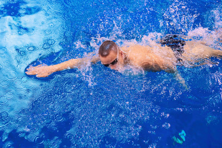 Male swimmer at the swimming pool. Underwater photo. Male swimmer.の写真素材