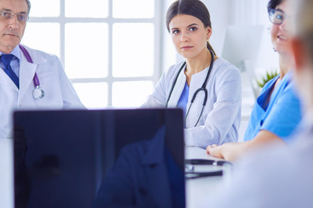 Doctors consulting with each other in a hospital conference roomの写真素材