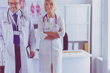 Portrait of group of smiling hospital colleagues standing togetherの写真素材