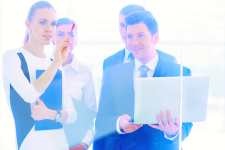 Group of business people doing presentation with laptop during meeting. Group of business peopleの写真素材