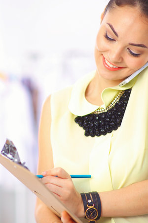 Modern young fashion designer working at studioの写真素材