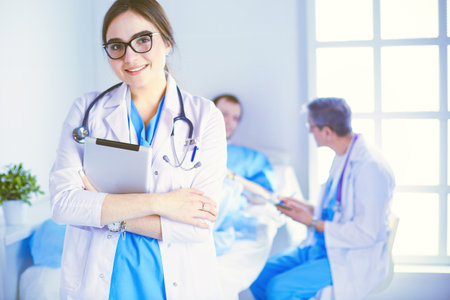 Female doctor using tablet computer in hospital lobbyの写真素材