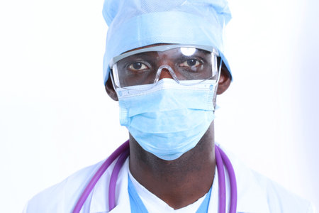 Portrait of a doctor wearing a mask and uniform. isolated on white background. Doctor.の写真素材