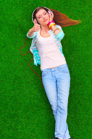 Young woman listening to the musicの写真素材