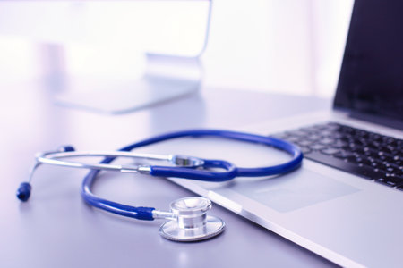 Medical equipment: blue stethoscope and tablet on white background. Medical equipmentの写真素材