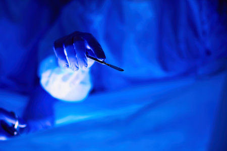 Cropped picture of scalpel taken doctors performing surgery.の写真素材