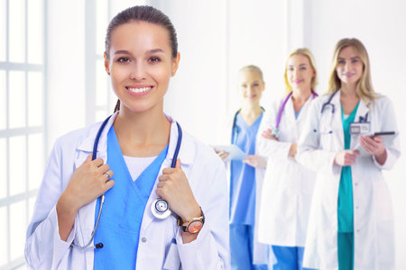 Woman doctor standing with stethoscope at hospital . Woman doctorの写真素材