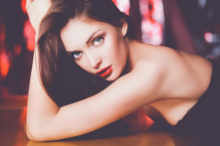 Portrait of beautiful girl with trendy makeup lyingの写真素材