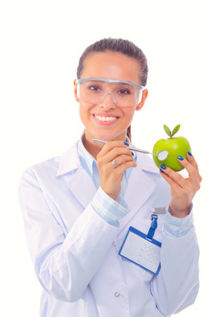 Smiling woman doctor with a green apple. Woman doctorの写真素材