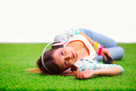Young woman listening to the music . Young womanの写真素材