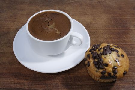 Cup of coffee and English muffinの写真素材
