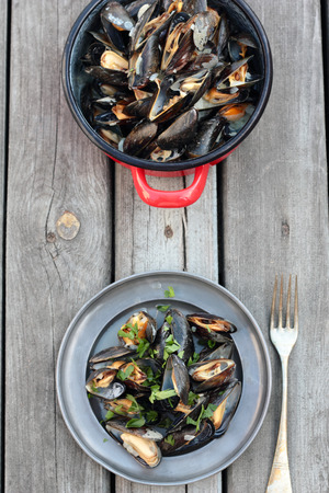 Steamed fresh mussels with wine and parsley.の写真素材