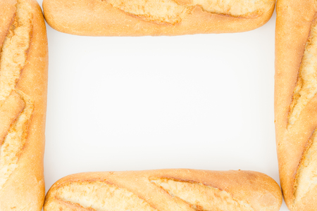 Bread frame, pieces of baguettes isolated on white.の写真素材