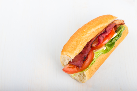 Fresh sandwich with tomatoes, bacon, and lettuce.の写真素材