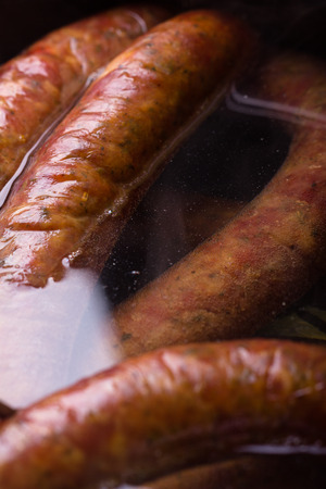 Traditional Polish sausage being steamed.の写真素材