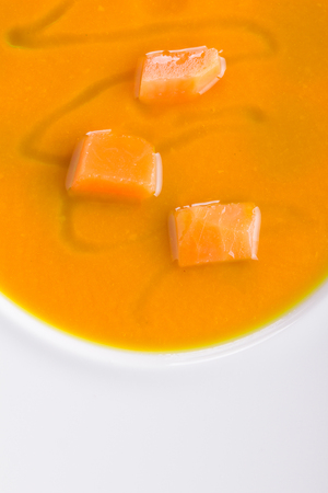 Pumpkin soup with large chunks of pumpkin drizzled with olive oil.の写真素材