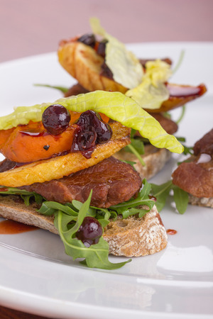 Roasted beef chick on a toast served with sauted carrot.の写真素材