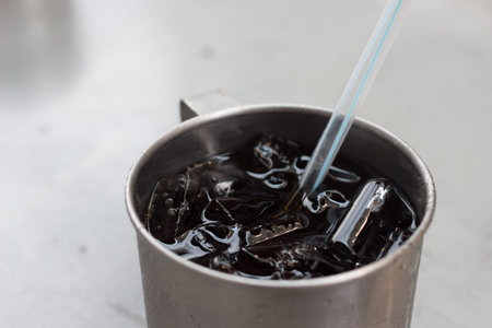 A Stainless Glass of Cola and Iceの写真素材