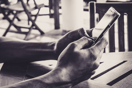 Close up photo of hands using mobile smartphone