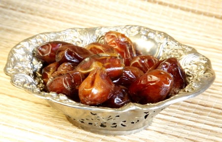 Dates in metal vase の写真素材