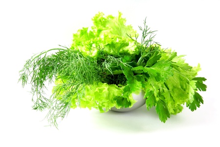 Fresh salad, parsley, dill on white backgroundの写真素材