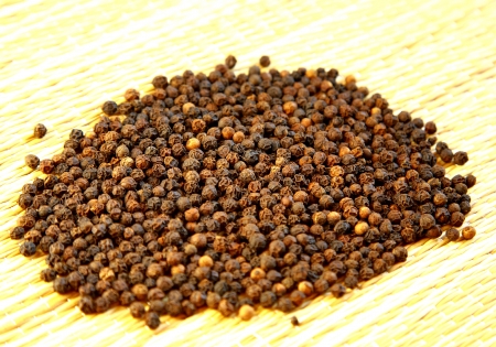 Black pepper indian spice in sunlightの写真素材