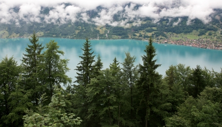 Beautiful turquoise lake Brienz in alpine mist Switzerlandの写真素材